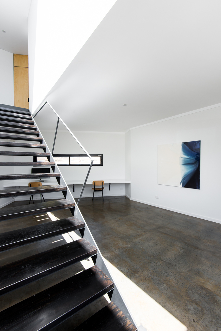 Living. Concrete floors. Local heroes: Triangle House by Robeson Architects. Image by Dion Photography. Vincent St, Mt. Lawley. Perth Residential Architecture. 